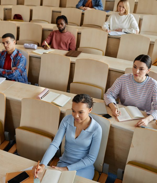 High angle view of group of students studying at lecture together at university